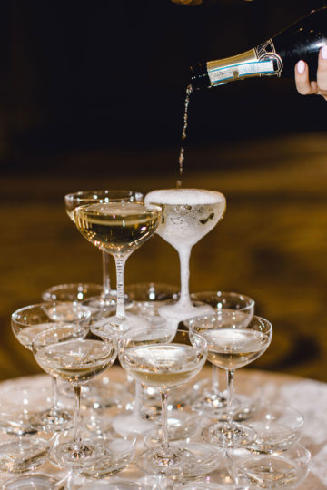 Pouring champagne for a champagne tower